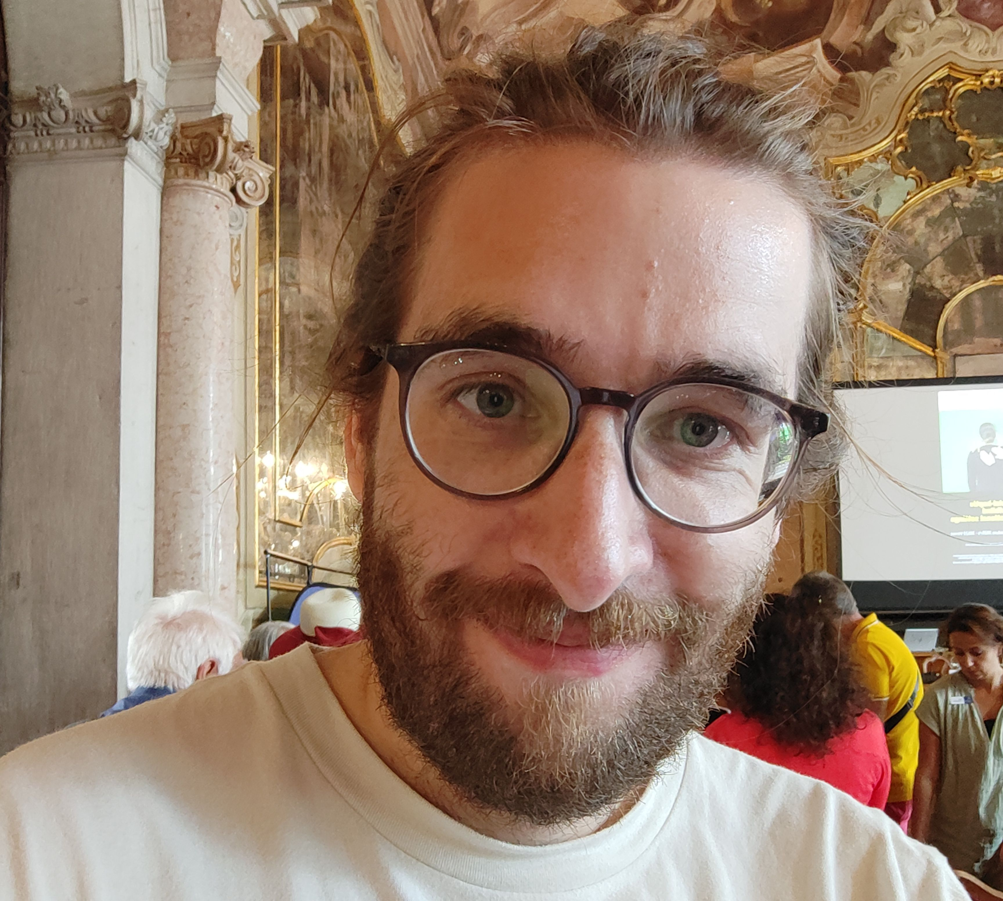 Close up photo of Craig smiling at a conference in Venice