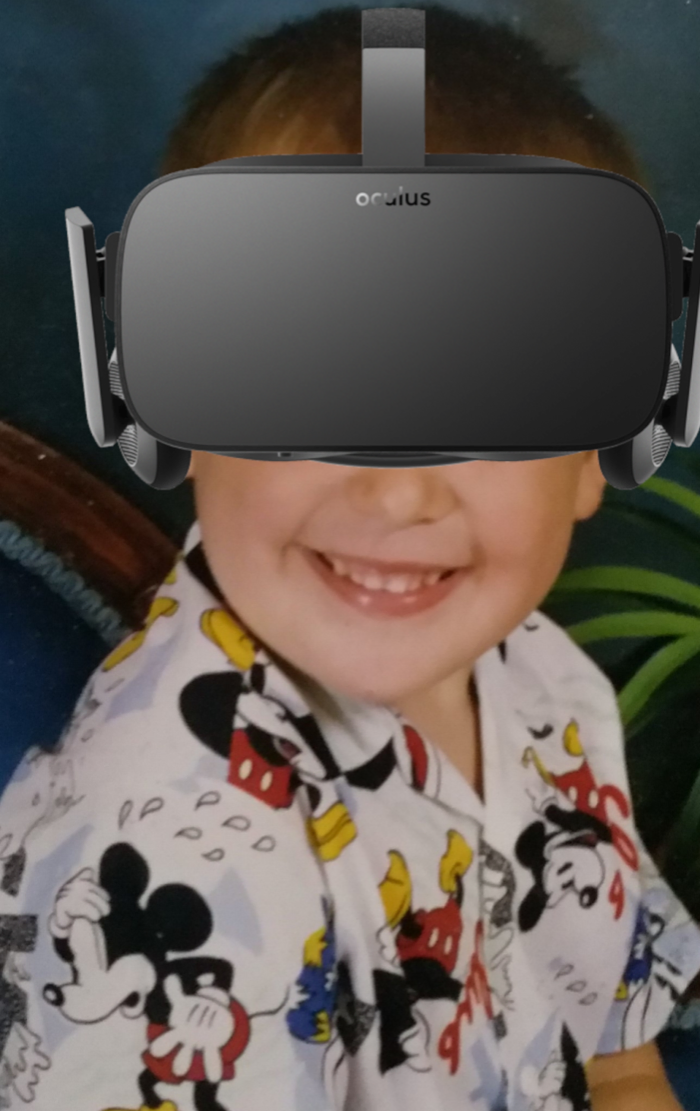 A person wearing an Oculus Rift VR headset smiling